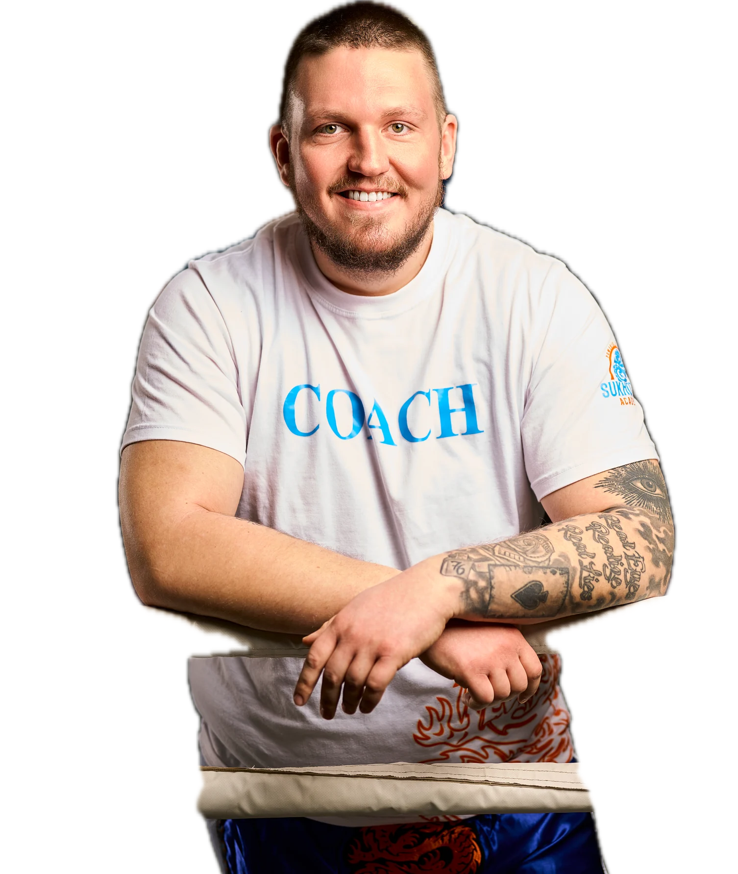 Trainer der Sukhothai Academy im COACH-Shirt